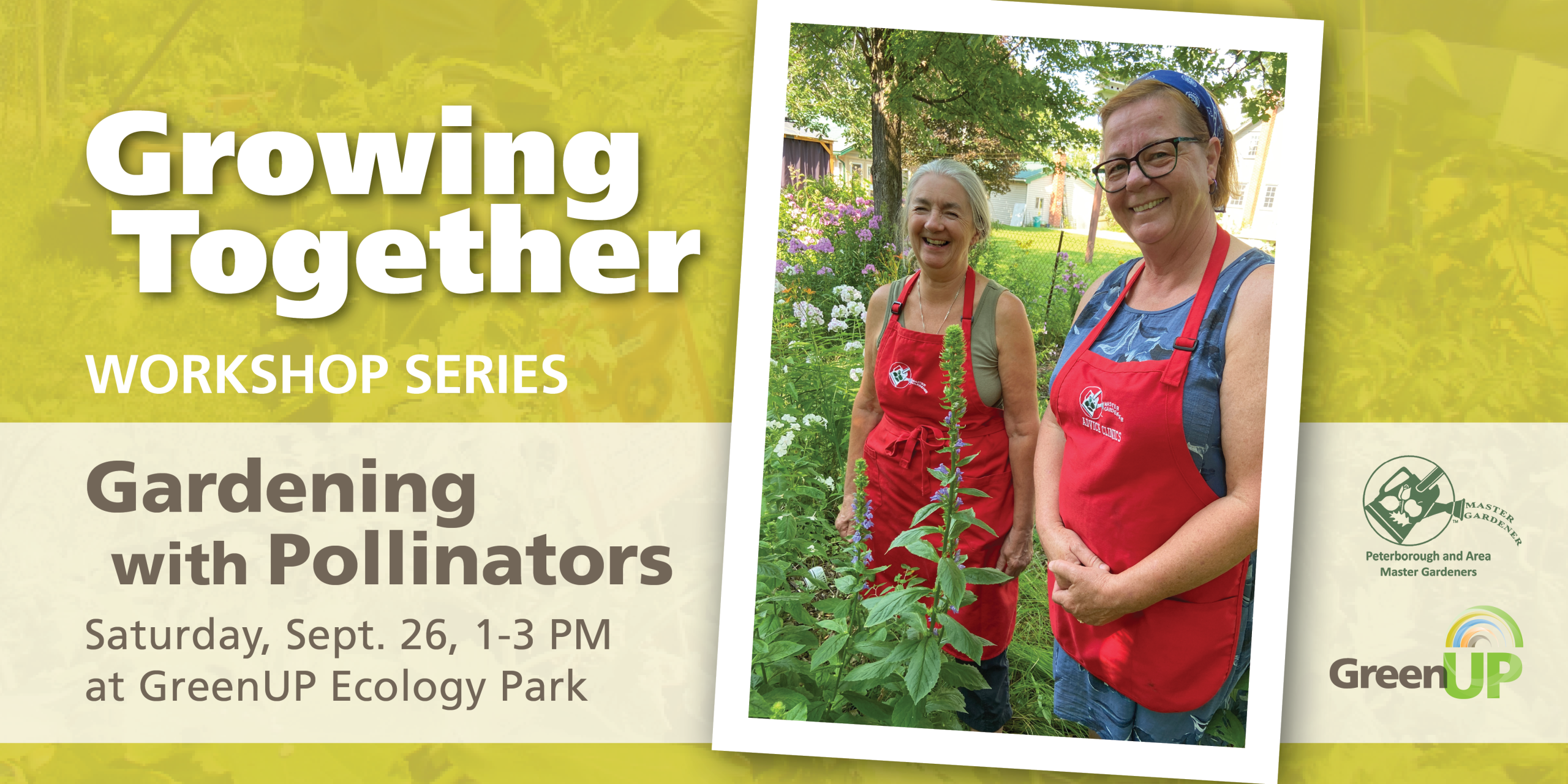 Two Master Gardeners are pictured smiling in a garden with many native wildflowers in bloom around them.